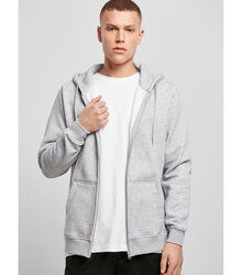 Build-your-Brand_Heavy-Zip-Hoody_BY012_lifestyle_Heather-Grey_front